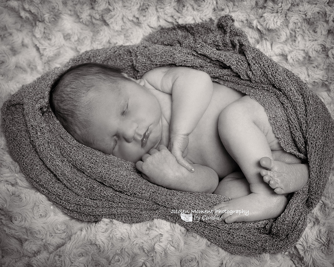sleeping baby curled up 