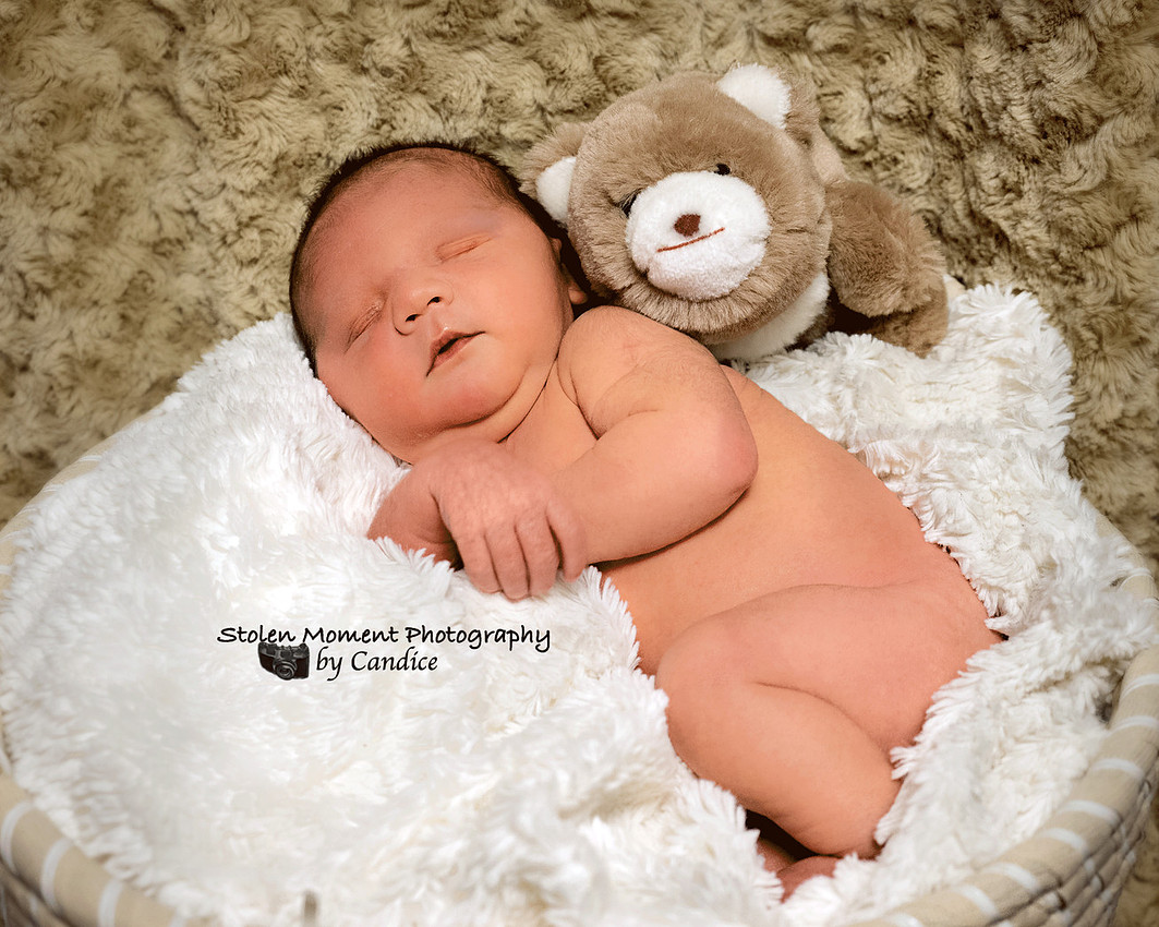 sleeping baby with his teddy bear