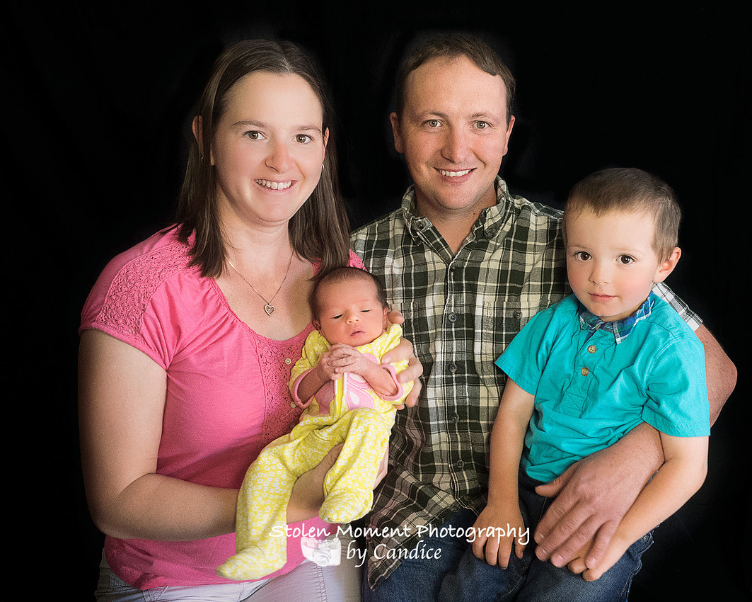 mom, dad, newborn girl and big brother