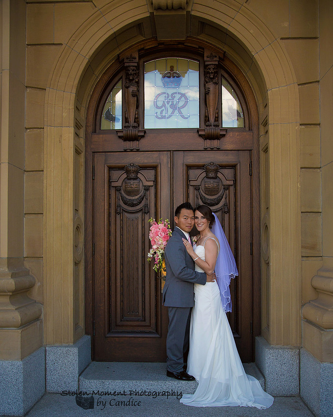 Bride and Groom in front of door at Legislature grounds