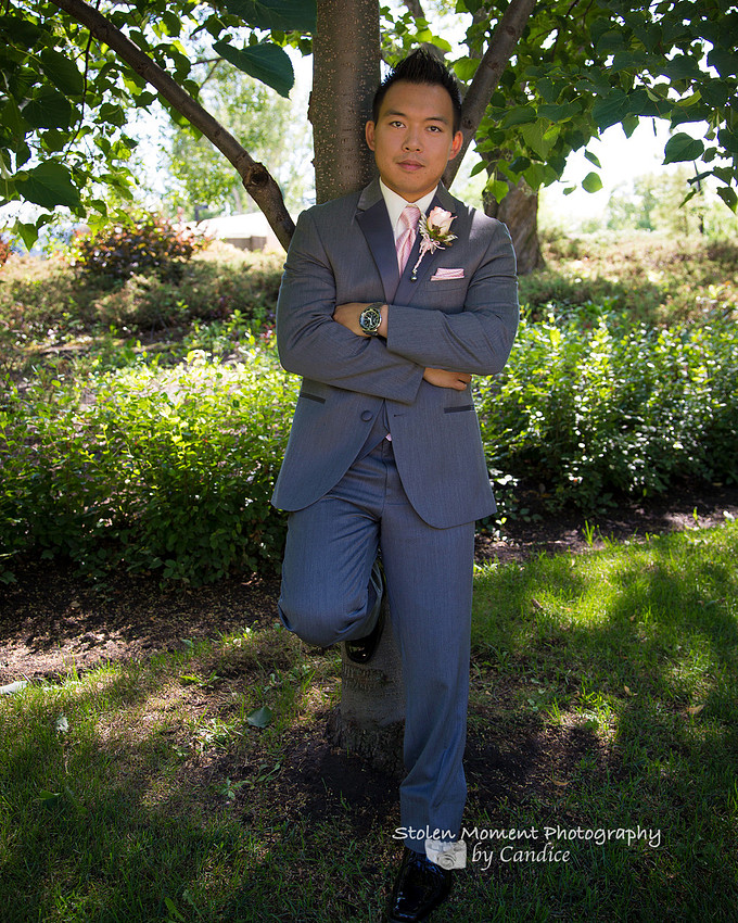 Groom alone by tree