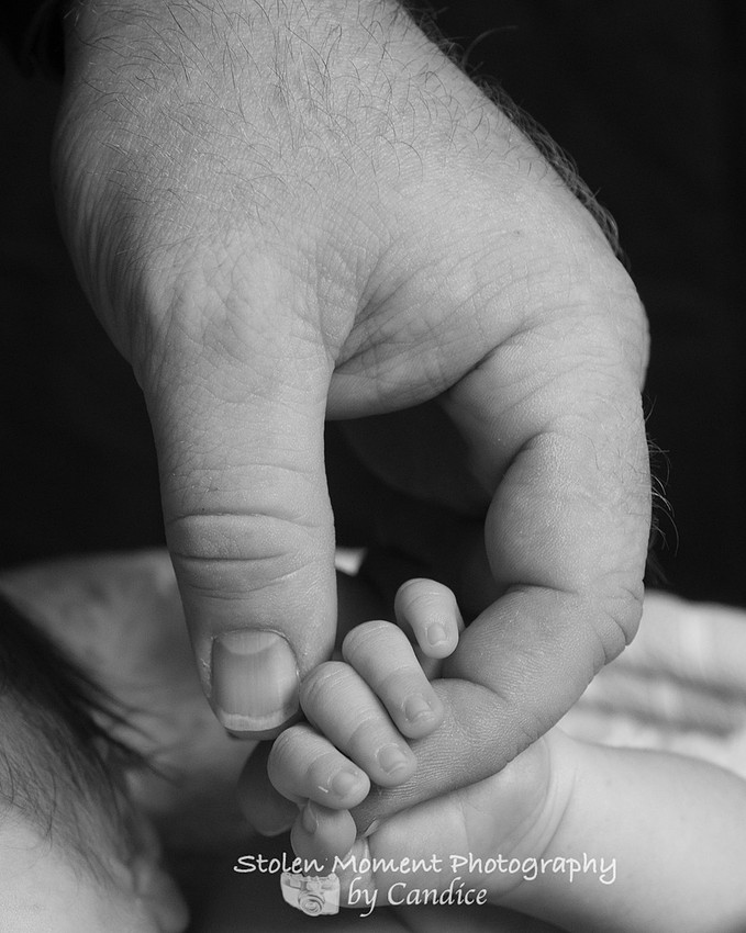 Dad and baby's hand