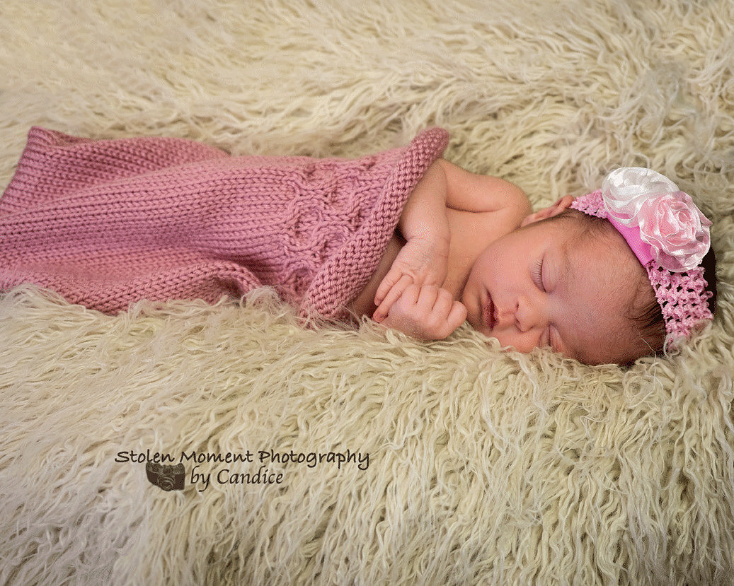 newborn girl sleeping in bunting bag