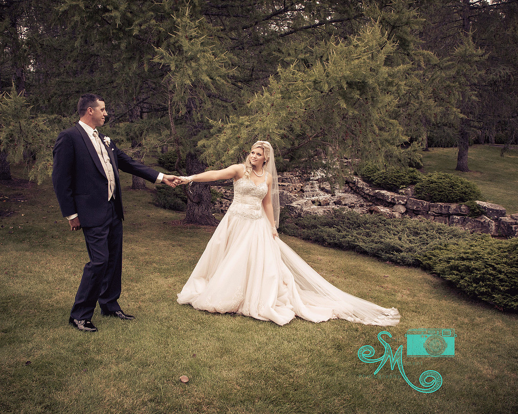 Bride pulling groom's hand for him to follow her