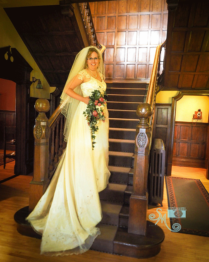 Bride on steps inside Rutherford House
