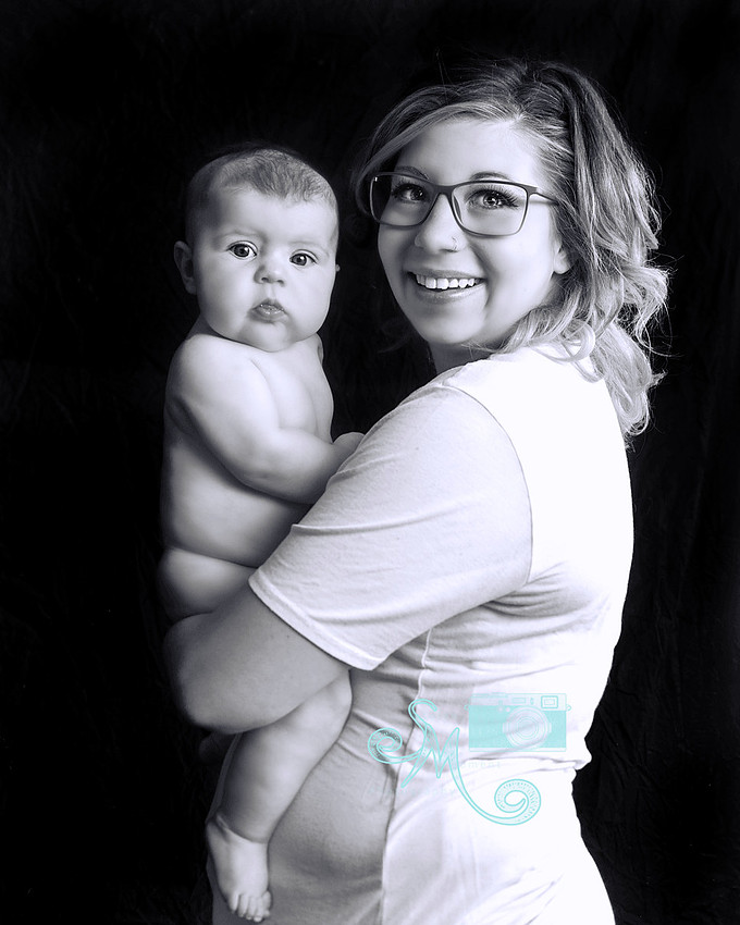 Mom holding her three month old daughter