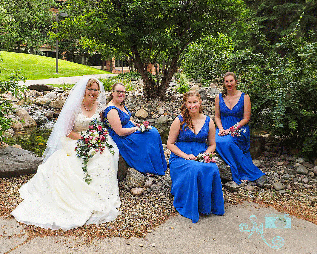 bride and bridesmaids on ground of University of Alberta 