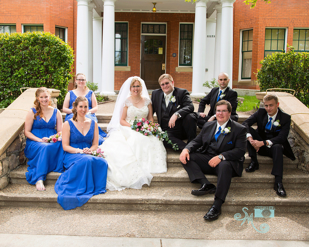 bridal party on steps of Rutherford House 