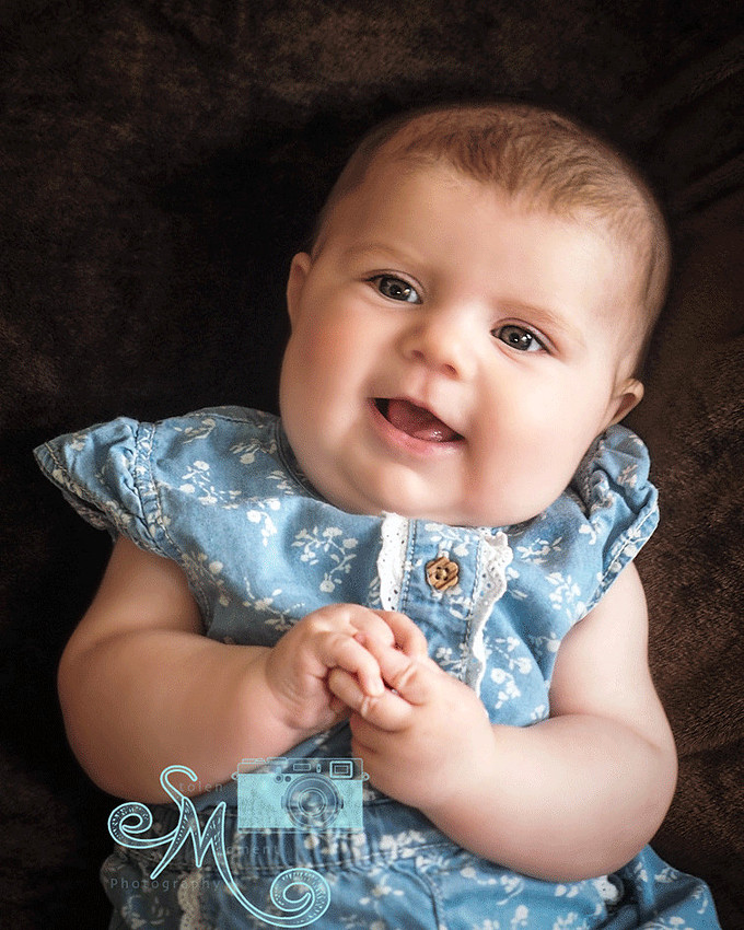 baby smiling at camera