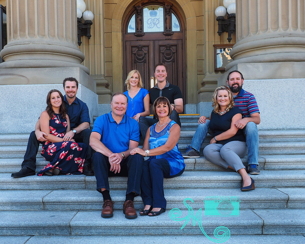 adult family on steps of Leg. grounds