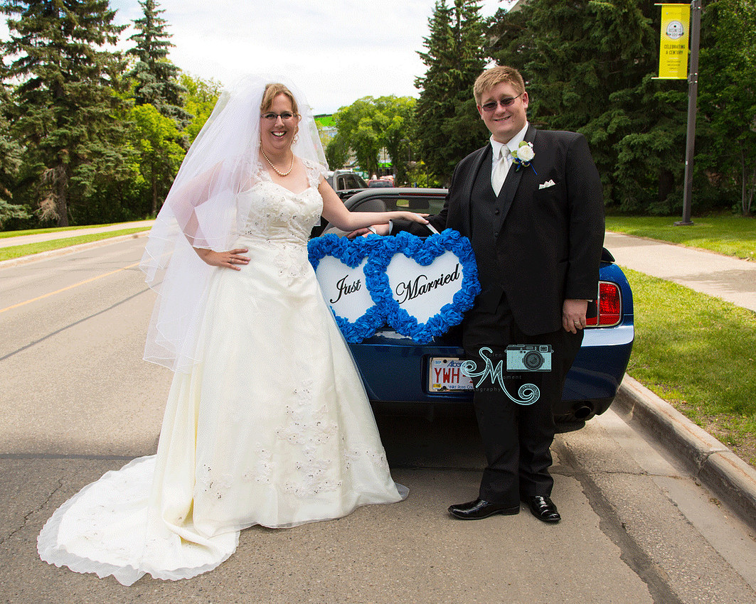 bride and groom with 2007 Shelby Mustang