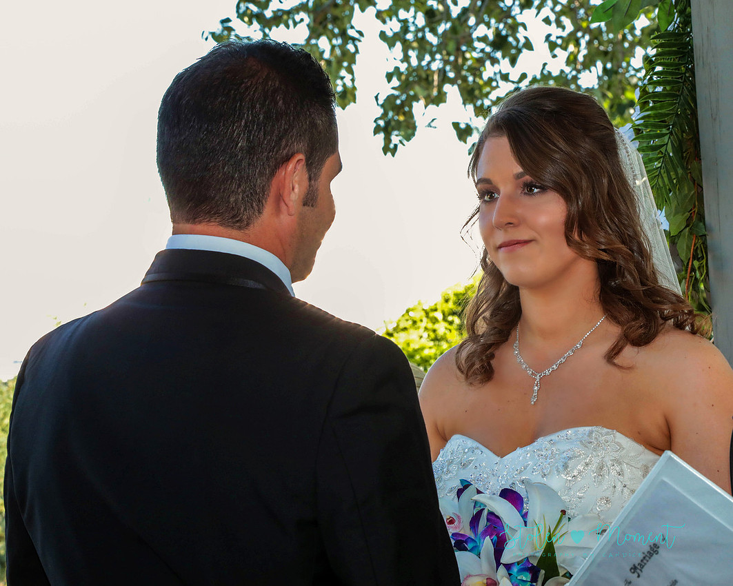 the bride looks into her groom's eyes as she says her vows