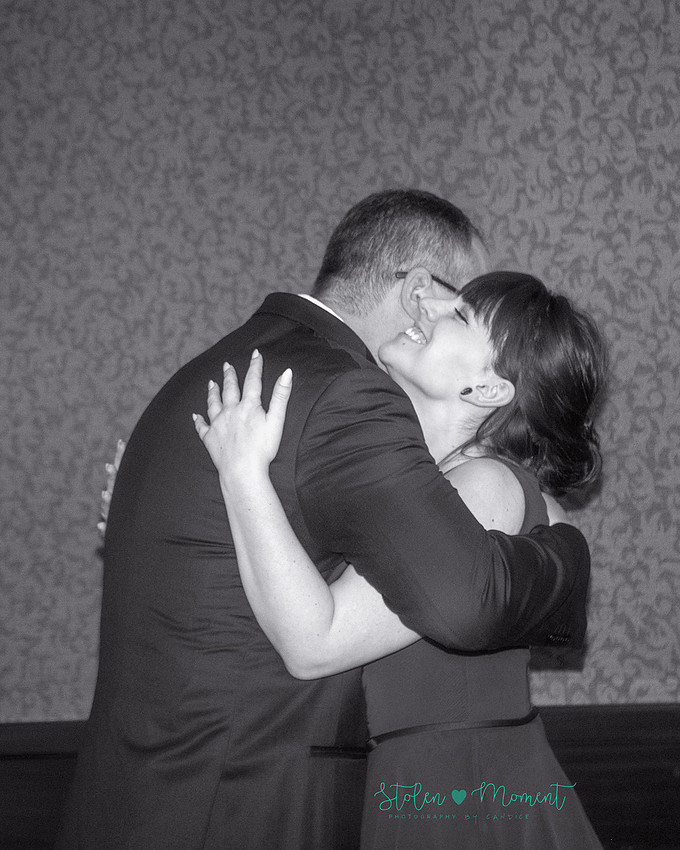a couple are married in an elegant and intimate wedding ceremony at Ruth's Chris restaurant.