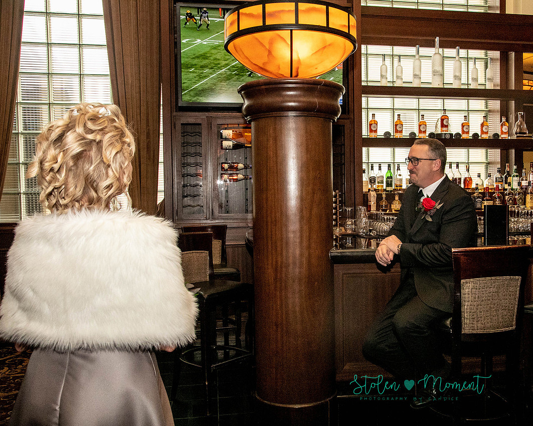 a couple are married in an elegant and intimate wedding ceremony at Ruth's Chris restaurant.