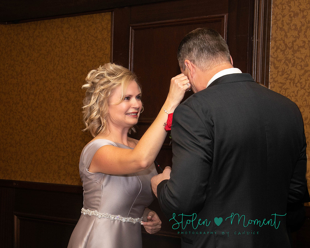 a couple are married in an elegant and intimate wedding ceremony at Ruth's Chris restaurant.