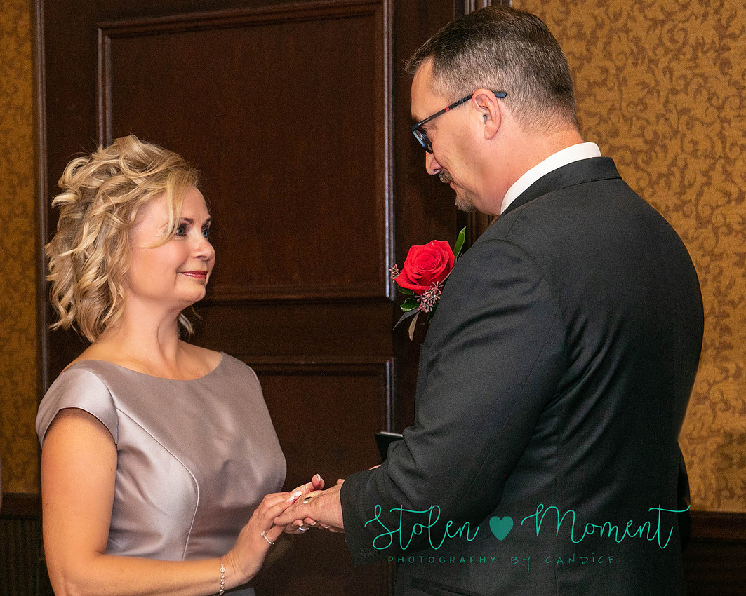 a couple are married in an elegant and intimate wedding ceremony at Ruth's Chris restaurant.