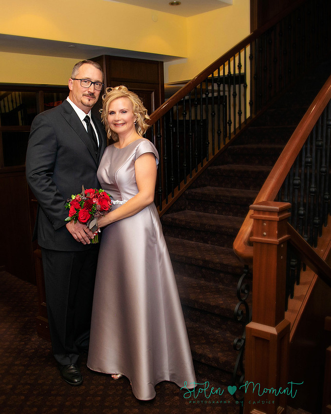 a couple are married in an elegant and intimate wedding ceremony at Ruth's Chris restaurant.