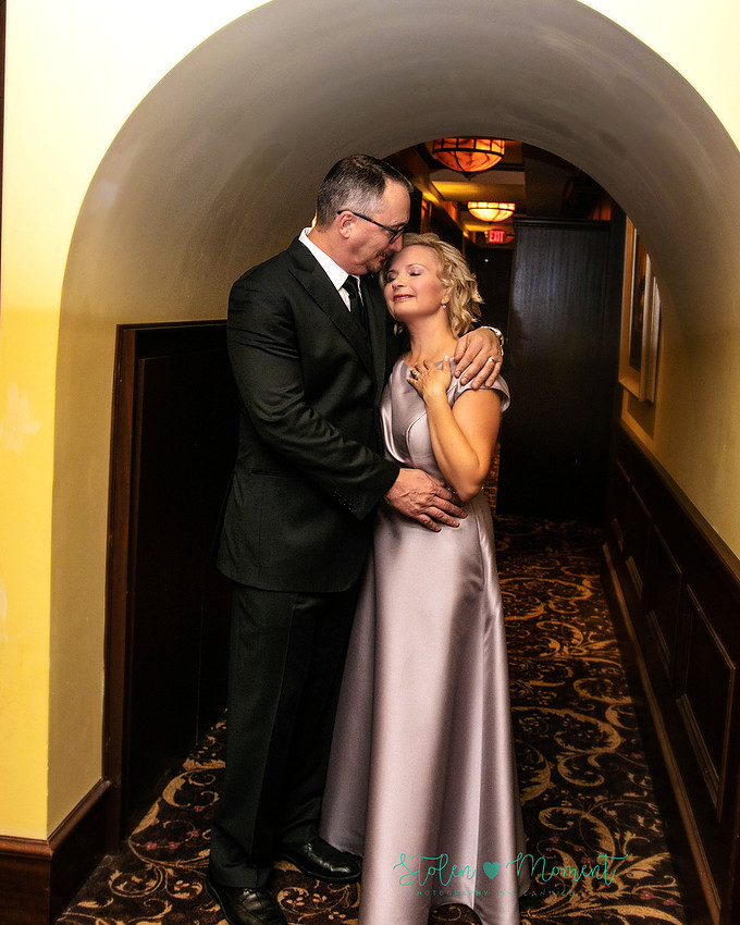a couple are married in an elegant and intimate wedding ceremony at Ruth's Chris restaurant.