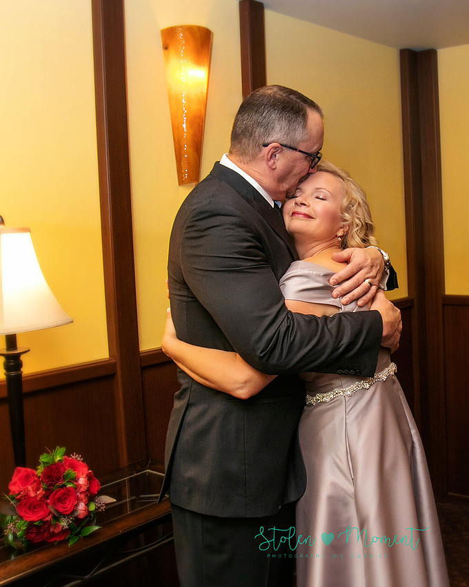 a couple are married in an elegant and intimate wedding ceremony at Ruth's Chris restaurant.