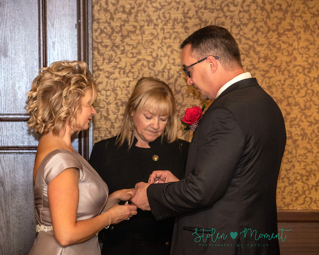 a couple are married in an elegant and intimate wedding ceremony at Ruth's Chris restaurant.
