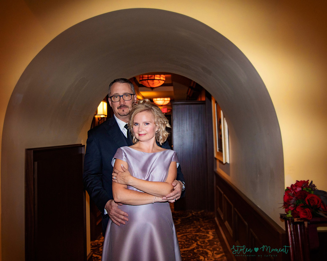 a couple are married in an elegant and intimate wedding ceremony at Ruth's Chris restaurant.