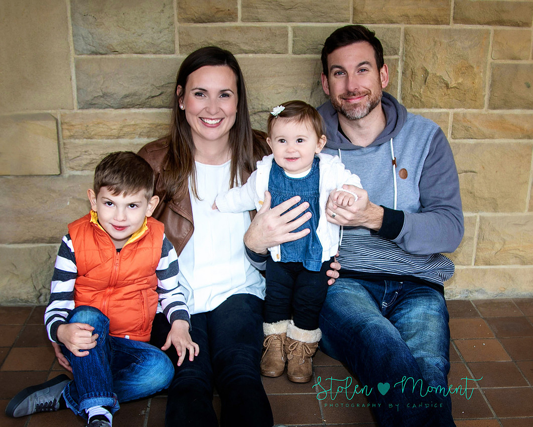 Family of four photographed at Government House in Edmonton on a chilly late fall day