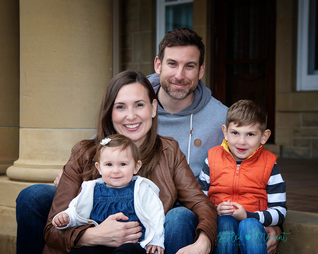 Family of four photographed at Government House in Edmonton on a chilly late fall day