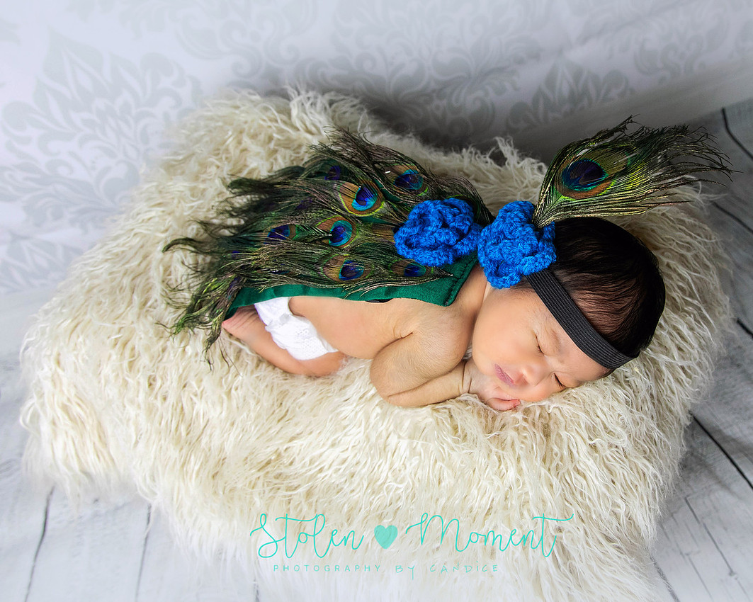 a seven day old newborn girl with her big sister, mom and dad and Grandma and Grandpa