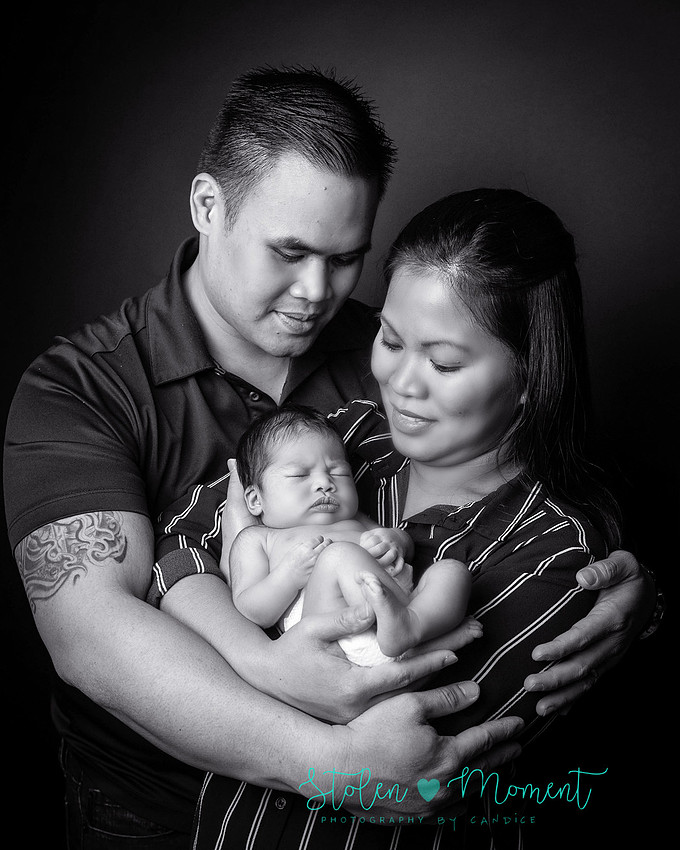 a seven day old newborn girl with her big sister, mom and dad and Grandma and Grandpa