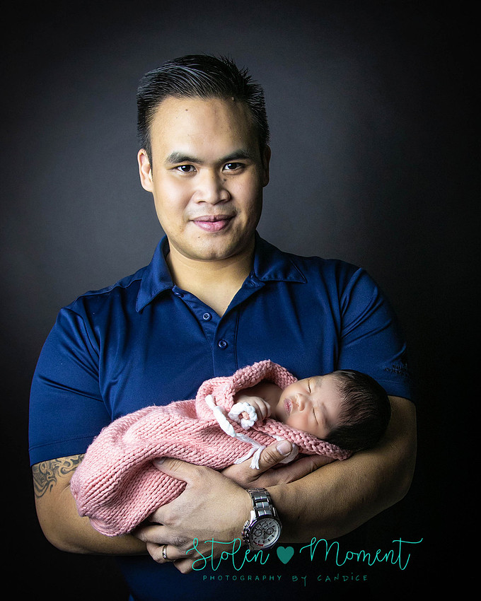 a seven day old newborn girl with her big sister, mom and dad and Grandma and Grandpa