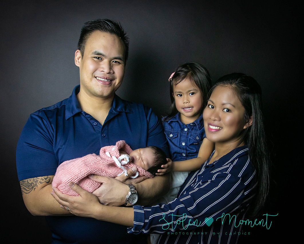 a seven day old newborn girl with her big sister, mom and dad and Grandma and Grandpa
