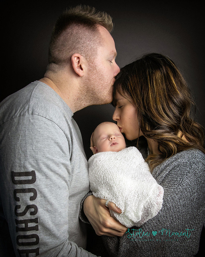 an 11 day old baby girl along with her mom and dad