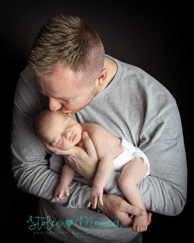 an 11 day old baby girl along with her mom and dad