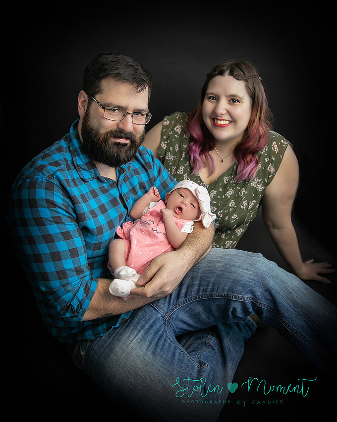 a 13 day old newborn girl alone and with her parents. 