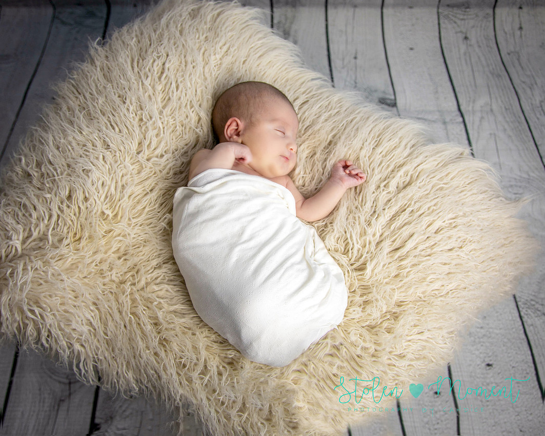 a 13 day old newborn girl alone and with her parents. 