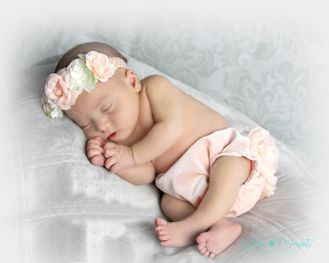 a 13 day old newborn girl alone and with her parents. 