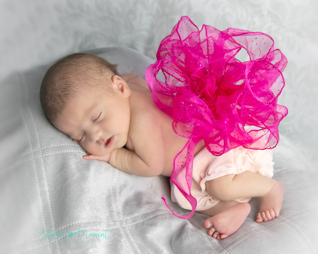 a 13 day old newborn girl alone and with her parents. 