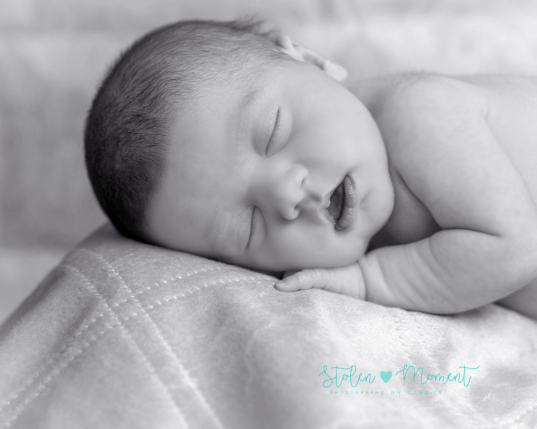 a 13 day old newborn girl alone and with her parents. 