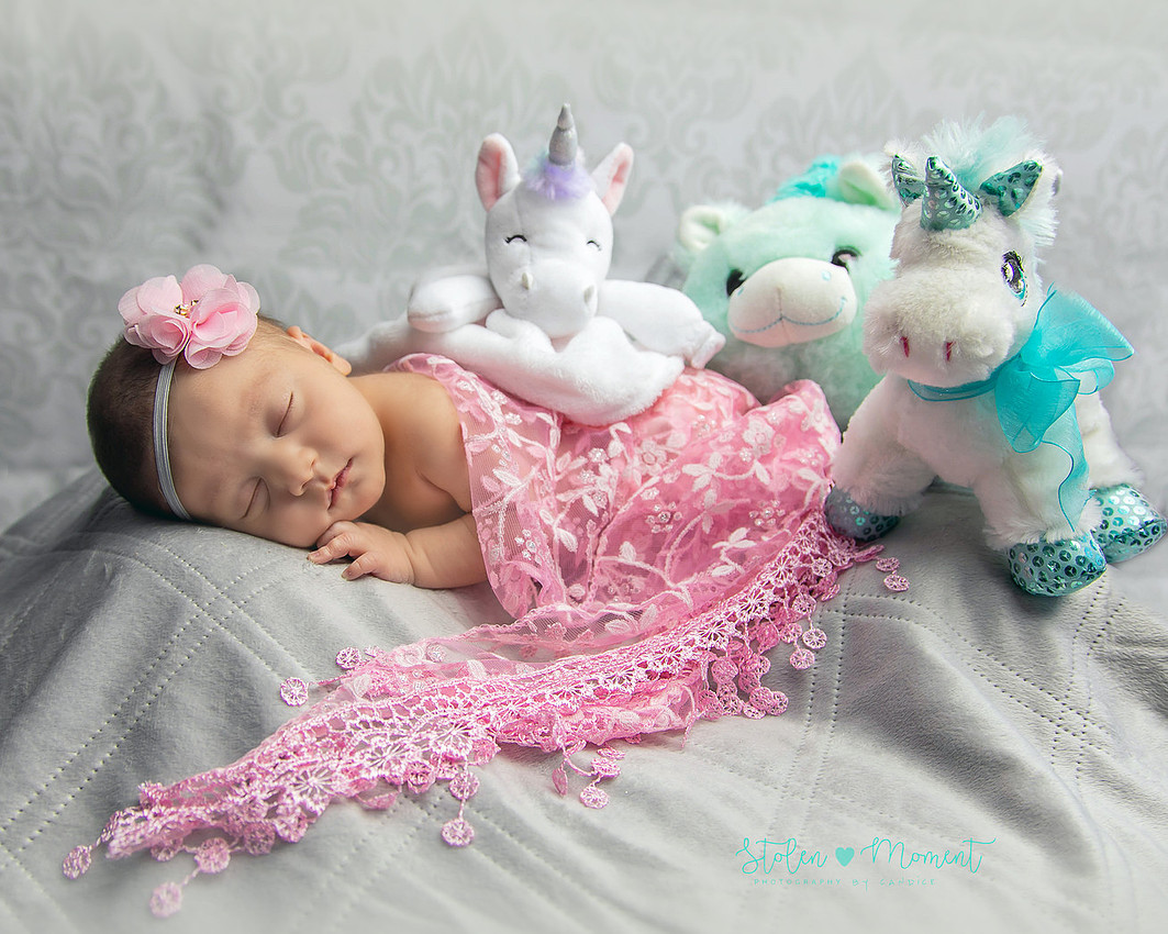 a 13 day old newborn girl alone and with her parents. 
