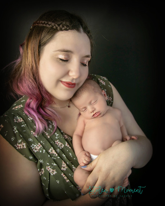 a 13 day old newborn girl alone and with her parents. 