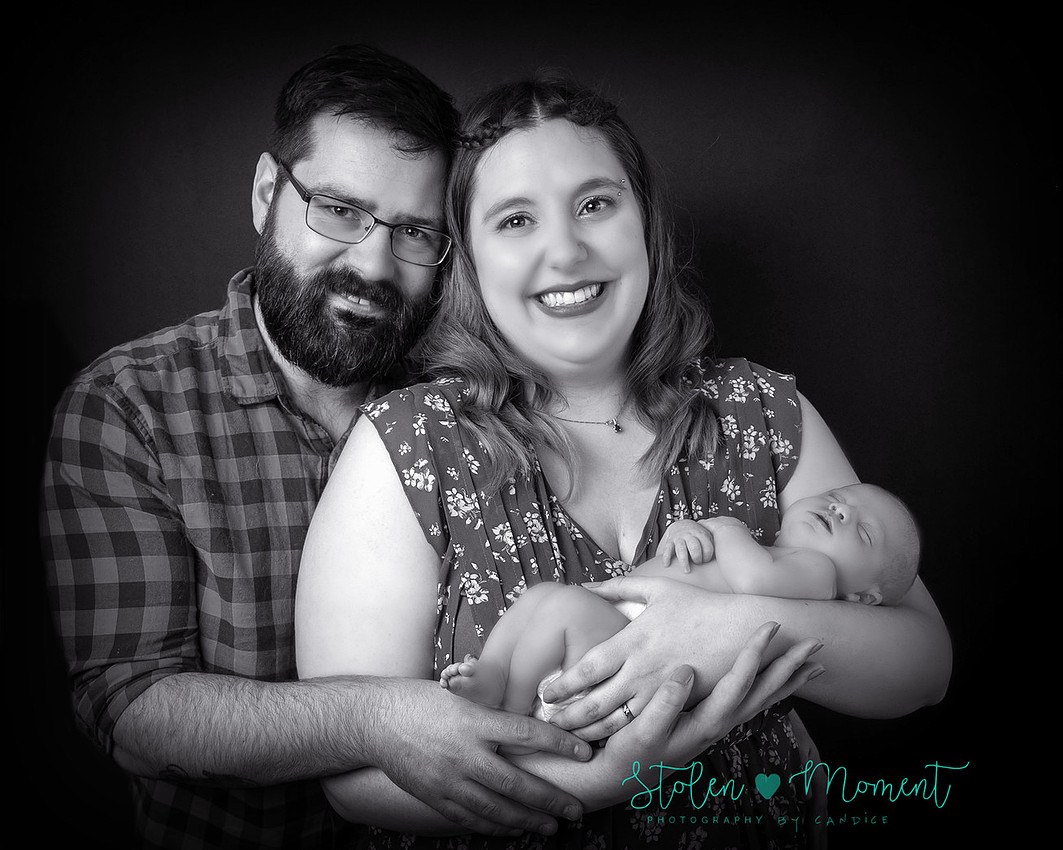 a 13 day old newborn girl alone and with her parents. 