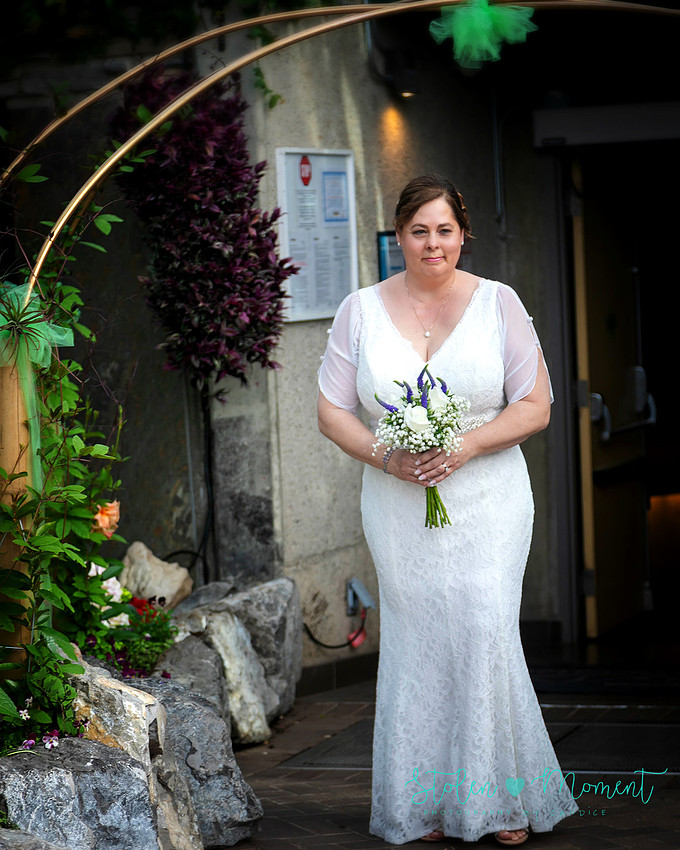 A couple wed in an intimate ceremony at the Muttart Conservatory in Edmonton