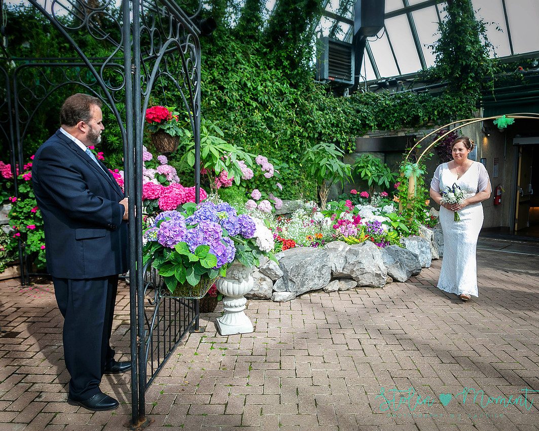 A couple wed in an intimate ceremony at the Muttart Conservatory in Edmonton