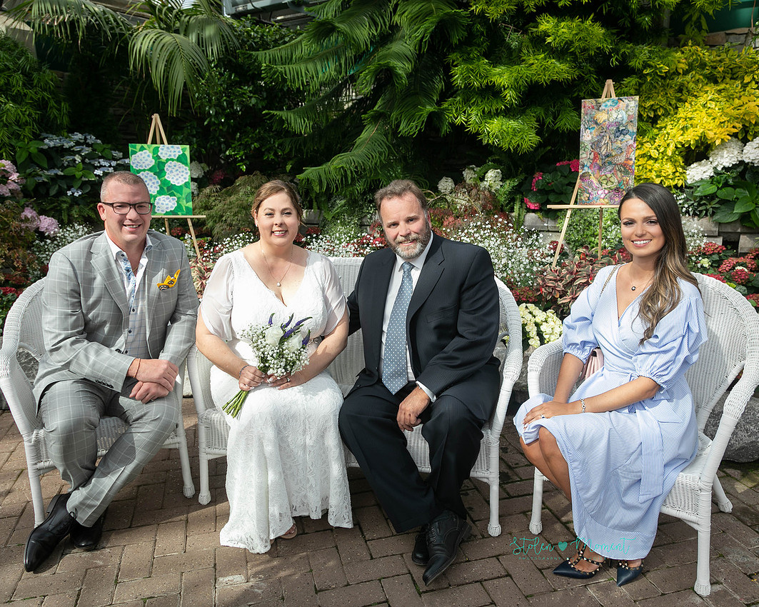 A couple wed in an intimate ceremony at the Muttart Conservatory in Edmonton
