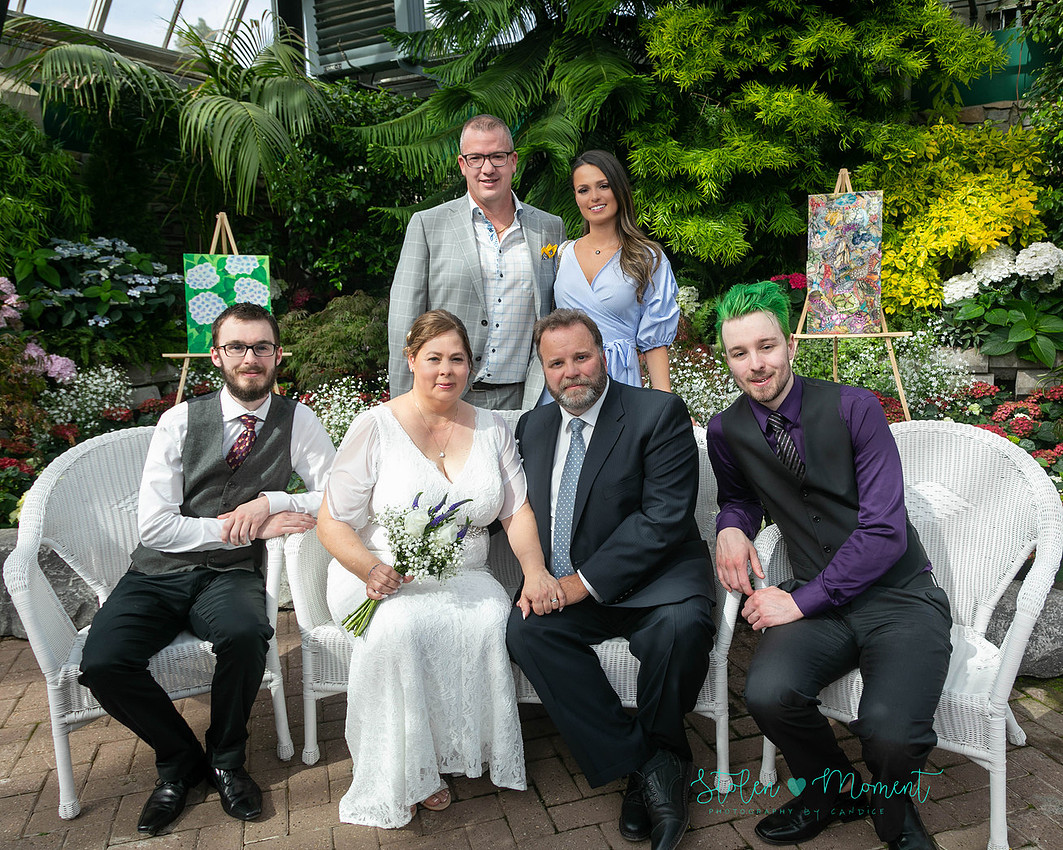 A couple wed in an intimate ceremony at the Muttart Conservatory in Edmonton