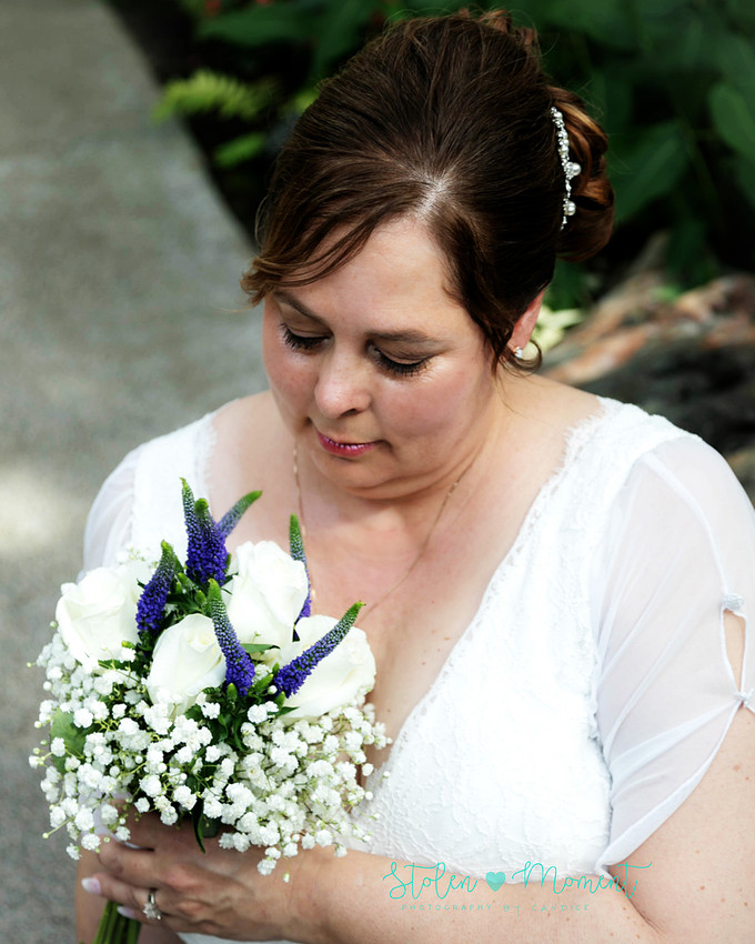 A couple wed in an intimate ceremony at the Muttart Conservatory in Edmonton