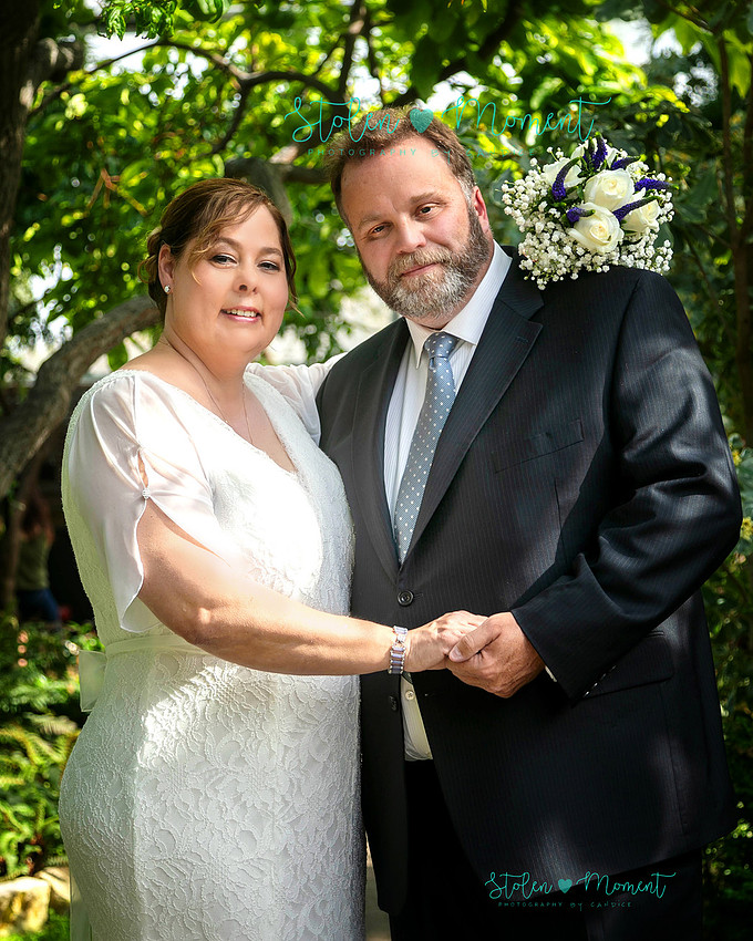 A couple wed in an intimate ceremony at the Muttart Conservatory in Edmonton