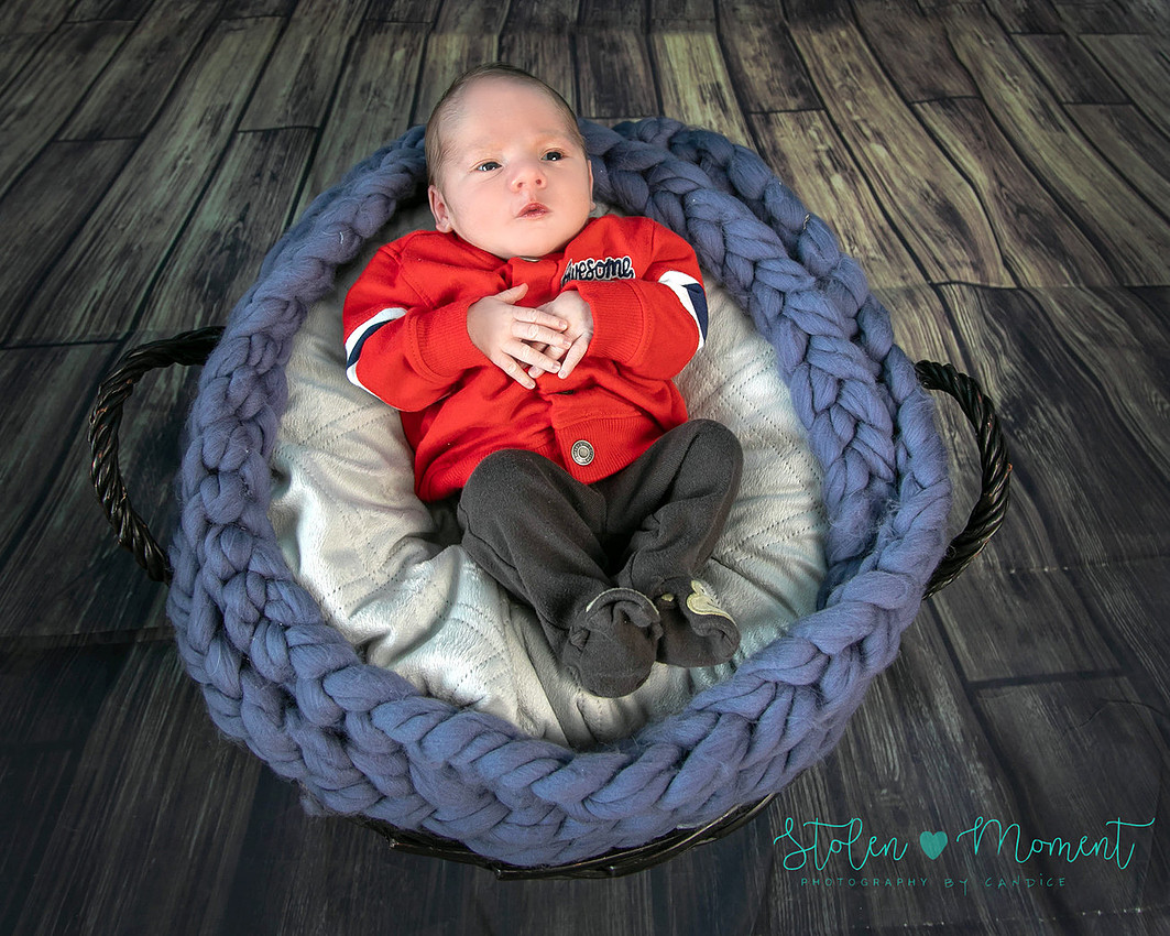 Welcoming a six day old boy in photos alone and with his two older sisters and mom and dad