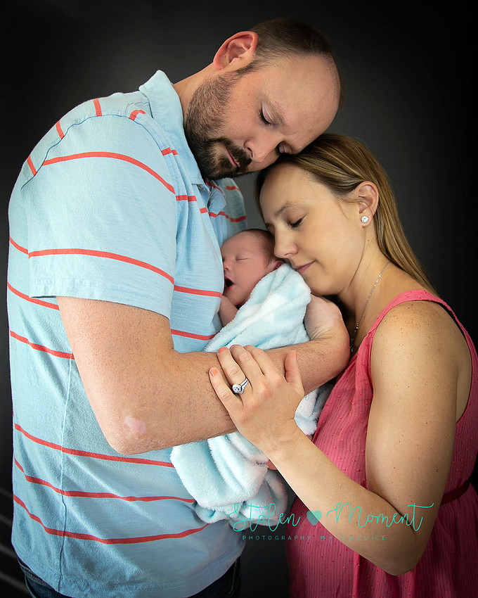 Welcoming a six day old boy in photos alone and with his two older sisters and mom and dad