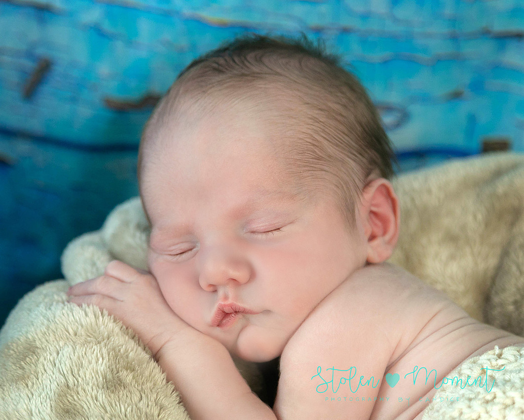 Welcoming a six day old boy in photos alone and with his two older sisters and mom and dad